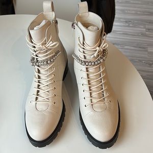 Jimmy Choo “latte” white Cruz boots with pearls.